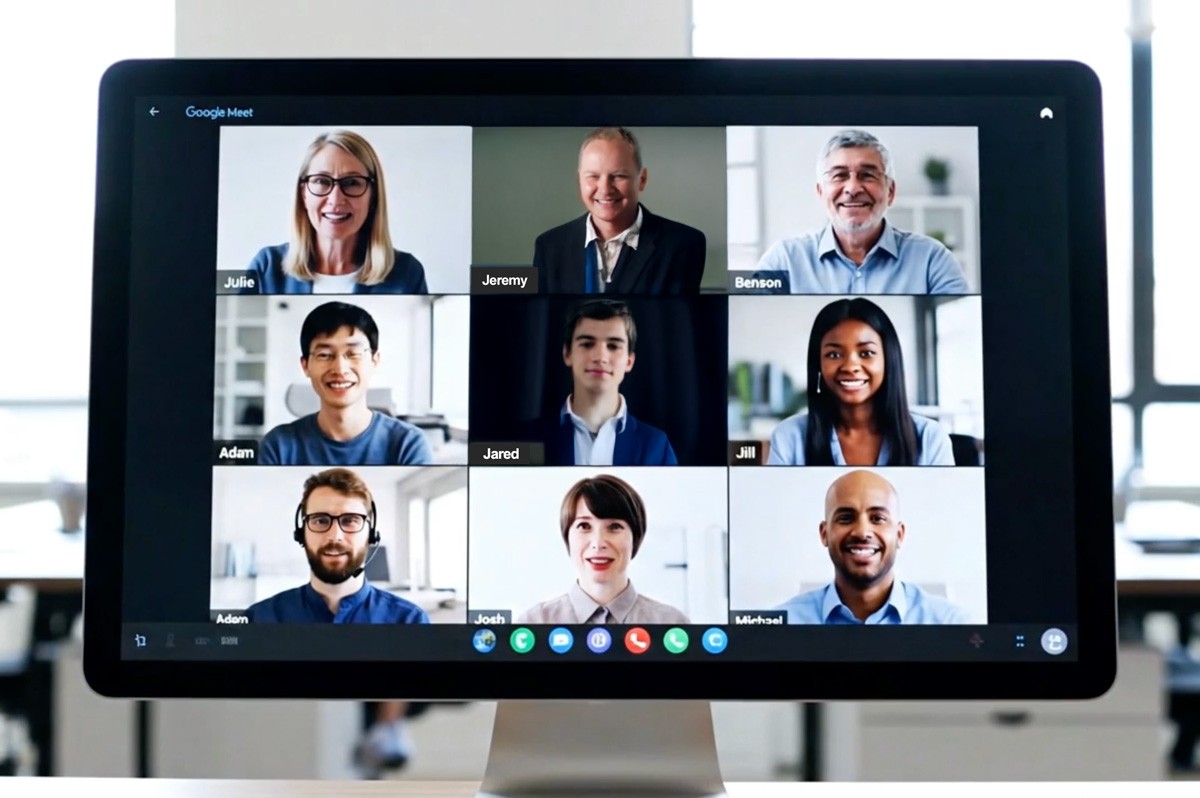 A video meeting displayed on a desktop monitor