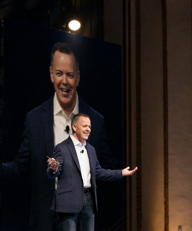 Contio founder Aaron Klein speaking on stage
